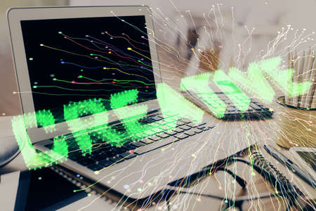 Desktop computer background in office and start up theme hologram drawing. Double exposure. Startup...