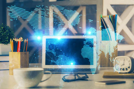 Computer on desktop with social network hologram. Multi exposure. Concept of international people...