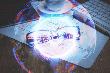 Tech theme hologram with glasses on the table background. Technology concept. Double exposure.
