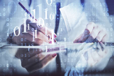 Double exposure of womans writing hand on background with data technology hud. Big data concept.