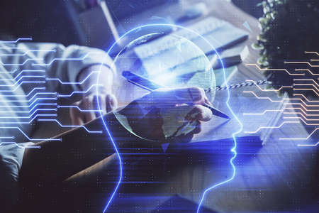 Multi exposure of writing hand on background with brain hologram. Concept of self learning.の写真素材