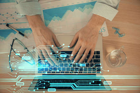 Businessman with computer background with technology theme hologram. Concept of big data. Double exposure.の写真素材