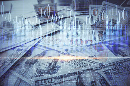 Multi exposure of forex chart drawing over us dollars bill background. Concept of financial success...