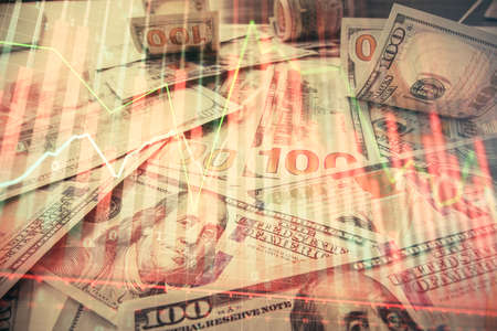Multi exposure of forex chart drawing over us dollars bill background. Concept of financial success...
