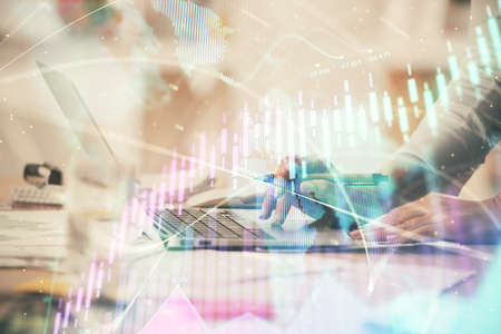 Double exposure of woman hands typing on computer and forex chart hologram drawing. Stock market...