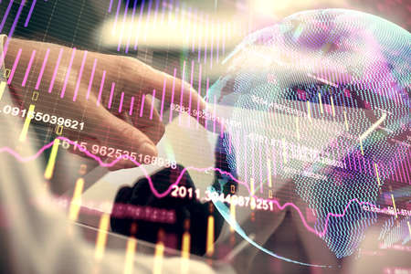 Multi exposure of mans hands holding and using a phone and financial chart drawing. Market analysis concept.の写真素材