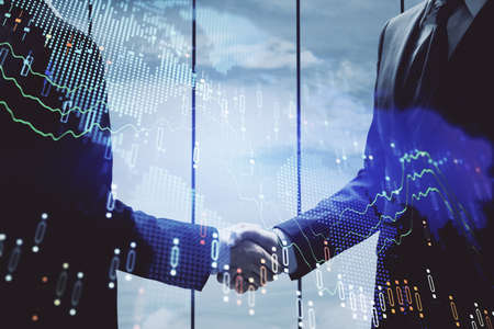 Double exposure of forex graph hologram and handshake of two men. Stock market concept.