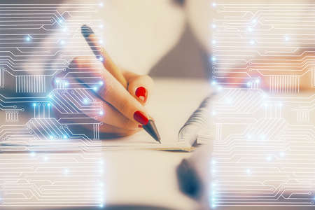 Technology theme hologram over womans hands taking notes background. Concept of Tech. Double exposureの写真素材