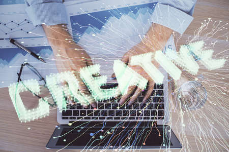Start up drawings with businessman working on computer on background. Teamwork concept. Double exposure.の写真素材