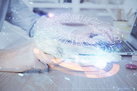 A man working on computer with technology theme drawing. Concept of big data. Multi exposure.の写真素材