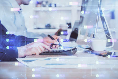 Double exposure of data internet theme hologram with man working on computer on background. Concept of innovation.の写真素材
