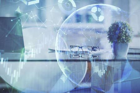Double exposure of financial graph drawing and office interior background. Concept of stock market.の写真素材