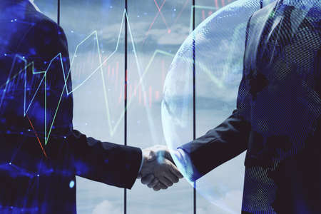 Double exposure of forex graph hologram and handshake of two men. Stock market concept.