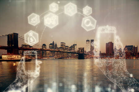 Double exposure of technology theme hologram and cityscape background. Concept of Hightech.