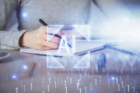 Double exposure of writing hand on background with data technology hologram. Big data concept.