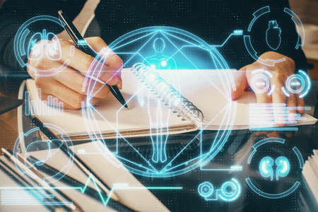 Education theme hologram over woman's hands writing background. Concept of study. Double exposure