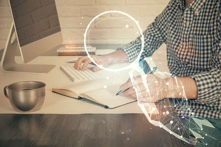 Start up drawings with businessman working on computer on background. Teamwork concept. Double...