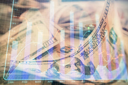 Double exposure of forex graph drawing over us dollars bill background. Concept of financial...
