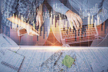 Multi exposure of man and woman working together and forex graph hologram drawing. Financial...