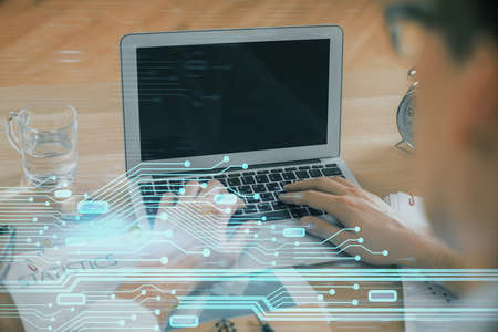 Businessman with computer background with technology theme hologram. Concept of big data. Double...