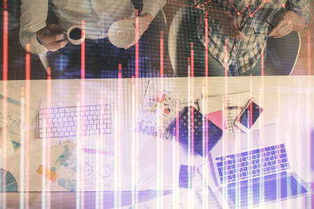 Double exposure of man and woman working together and financial chart hologram drawing. market...
