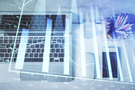 Multi exposure of forex graph drawing over desktop background with computer. Concept of financial...