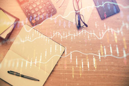 Double exposure of forex graph drawing and work table top veiw. Concept of financial analysis.