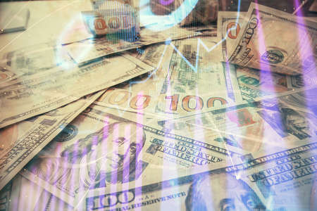Multi exposure of forex chart drawing over us dollars bill background. Concept of financial success markets.の写真素材