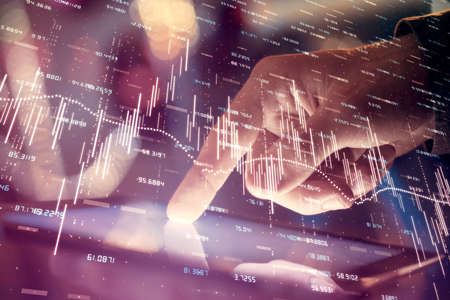 Multi exposure of mans hands holding and using a phone and financial chart drawing. Market analysis...