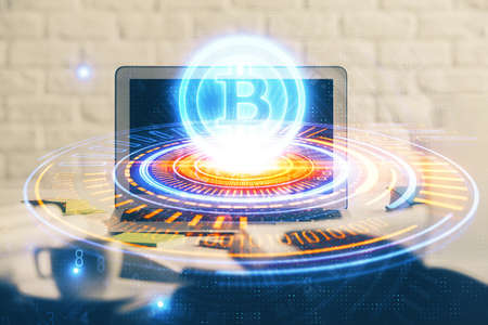 Multi exposure of blockchain and crypto economy theme hologram and table with computer background....