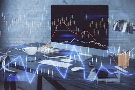 Financial graph colorful drawing and table with computer on background. Multi exposure. Concept of...