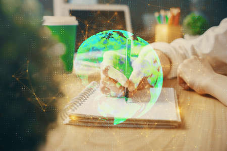 Social network theme hologram over womans hands writing background. Concept of international people...