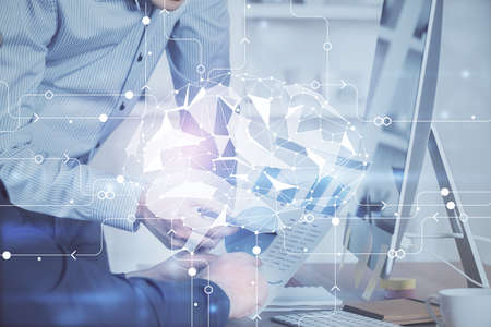 Man with computer background with brain theme hologram. Concept of brainstorm. Double exposure.の写真素材