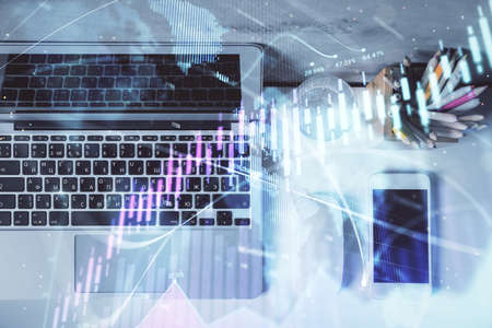 Multi exposure of forex graph drawing over desktop background with computer. Concept of financial...