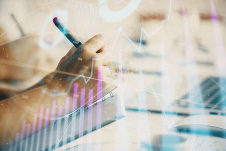 Double exposure of forex chart drawing over people taking notes background. Concept of financial...