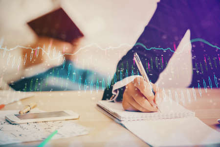 Double exposure of forex chart drawing over people taking notes background. Concept of financial...
