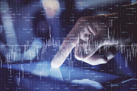 Multi exposure of mans hands holding and using a phone and financial chart drawing. Market analysis...