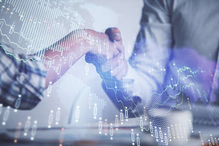 Double exposure of forex graph hologram and handshake of two men. Stock market concept.