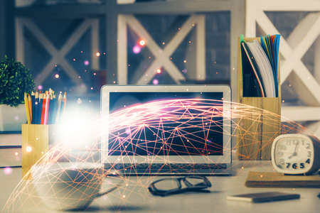 Computer on desktop with social network hologram. Multi exposure. Concept of international people...