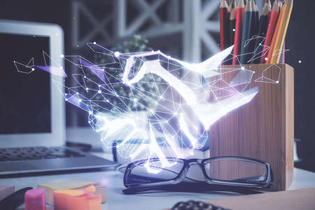 Handshake hologram with glasses on the table background. New start concept. Double exposure.の写真素材