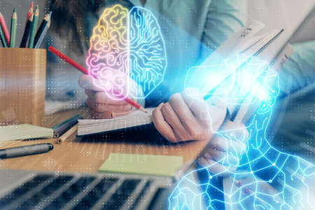 AR hologram over hands taking notes background. Concept of augmented reality. Double exposureの写真素材