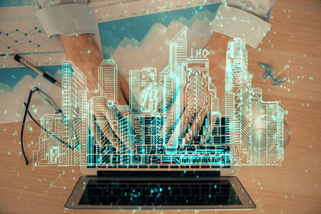 High tech city drawing with businessman working on computer on background. Smartcity concept. Double...