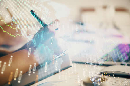 Double exposure of forex chart drawing over people taking notes background. Concept of financial...