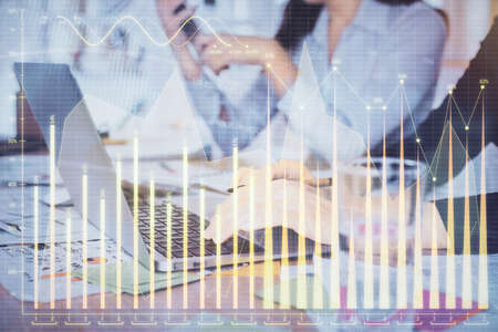 Multi exposure of woman hands typing on computer and forex chart hologram drawing. Stock market...