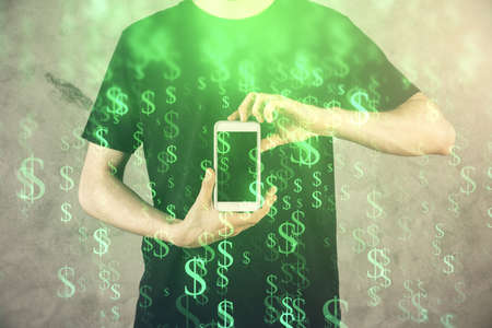 Double exposure of mans hands holding and using a digital device and forex graph drawing. Financial...