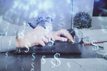 Double exposure of mans hands holding and using a phone and financial graph drawing. Analysis...