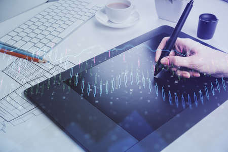 Double exposure of financial graph sketch hologram and woman holding and using a mobile device....