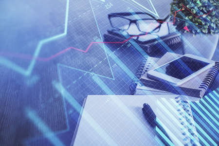 Double exposure of forex chart drawing and cell phone background. Concept of financial trading