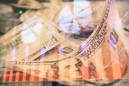 Double exposure of forex graph drawing over us dollars bill background. Concept of financial markets.の写真素材