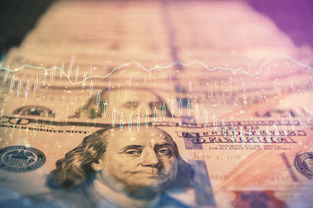Double exposure of forex graph drawing over us dollars bill background. Concept of financial markets.の写真素材